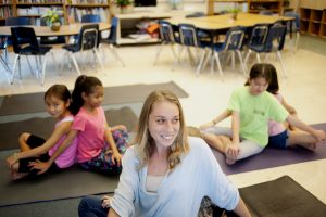 kids doing classroom yoga