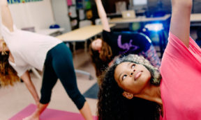 young women doing yoga stretches
