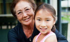 young girl with older woman smiling