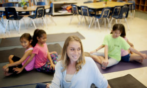 kids doing classroom yoga